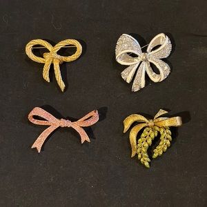 Lot of 4 now brooches pins. Joan Rivers, Nolan Miller, Kenneth jay lane